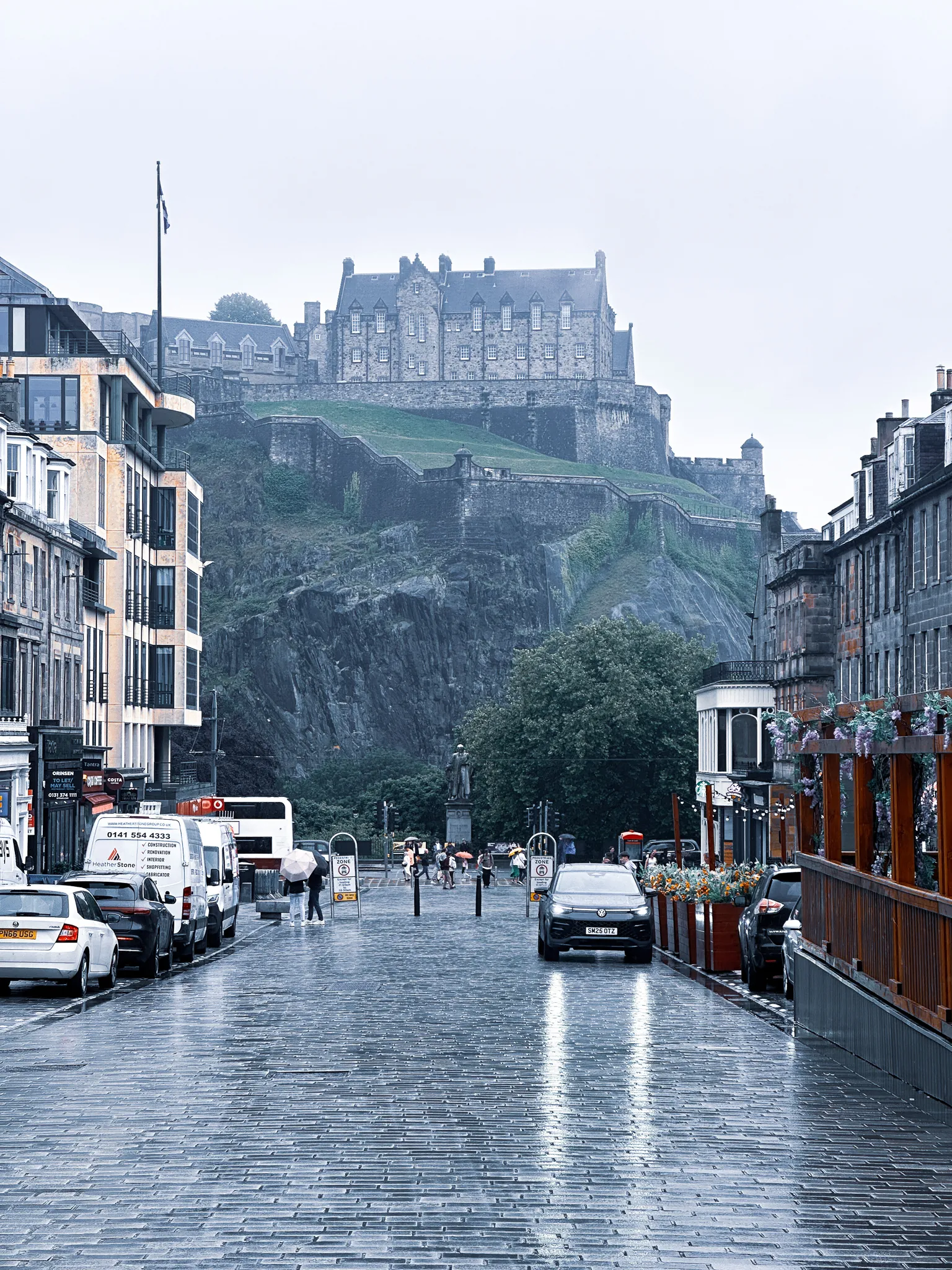 From the foot of Castle Street, the ramparts zig-zagging up the crag to the castle and the wet setts shining down the middle of the road
