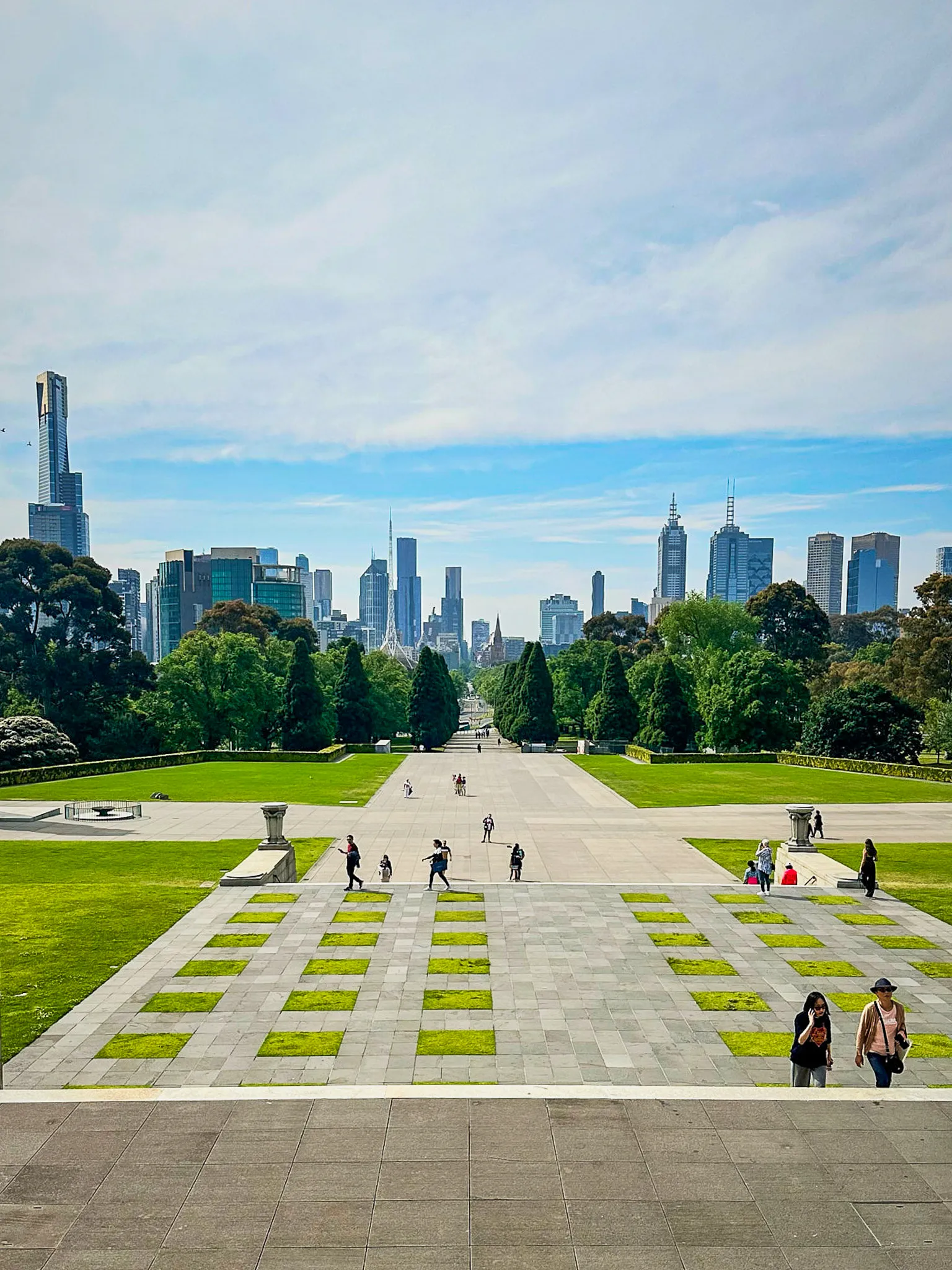 The forecourt of the Shrine of Remembrance looking north, the city skyline beyond the trees